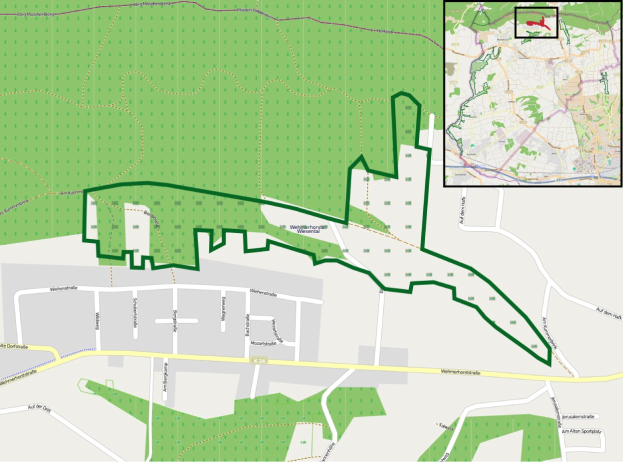 Eine detaillierte Stadtkarte, die eine vorgeschlagene Stelle in Grün hervorhebt und Straßen, Gebäude und andere städtische Merkmale zeigt.