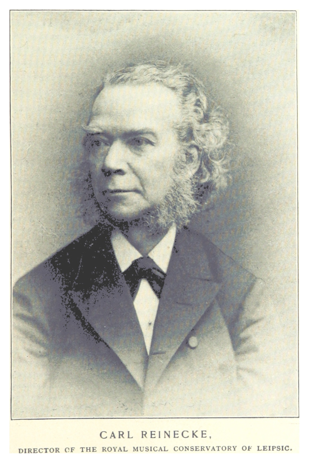 Ein Schwarz-Weiß-Foto von Carl Reinecke, dem Direktor des Königlichen Musikalischen Konservatoriums Leipzig, der einen Anzug trägt, mit Text am unteren Bildrand.