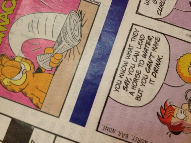 Eine Zeitung mit Cartoons und Text.